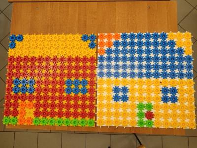 Uczniowie układają domek z różnych figur geometrycznych.