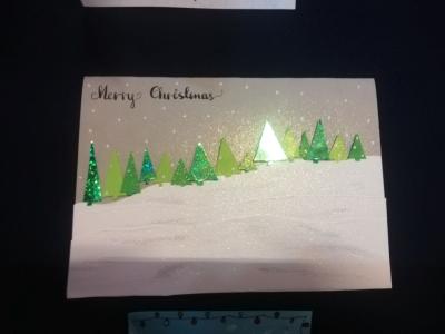 Zdjęcie przedstawia kartkę bożonarodzeniową.