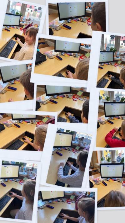 dzieci na świetlicy odpowiadają na pytania ewaluacyjne na zakończenie projektu Misja na 4 łapy na komputerze